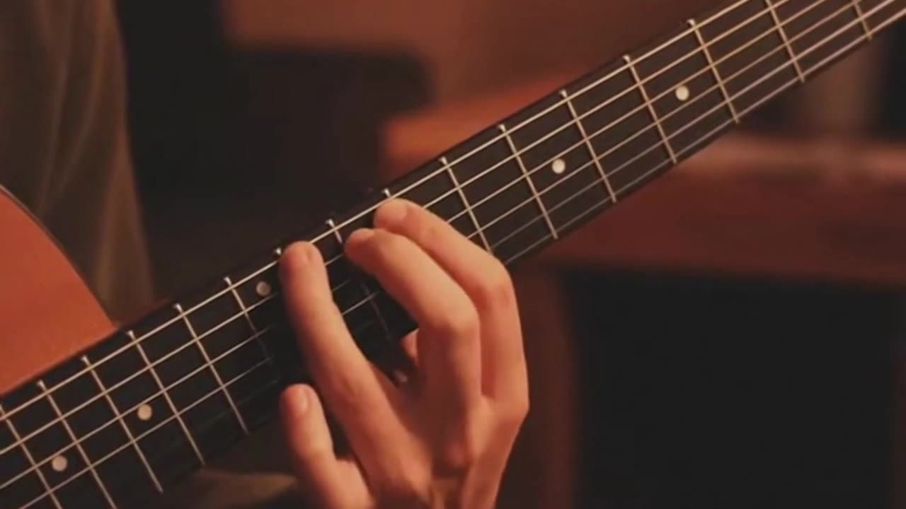 OpenAI Sora 2: Fretting a guitar chord